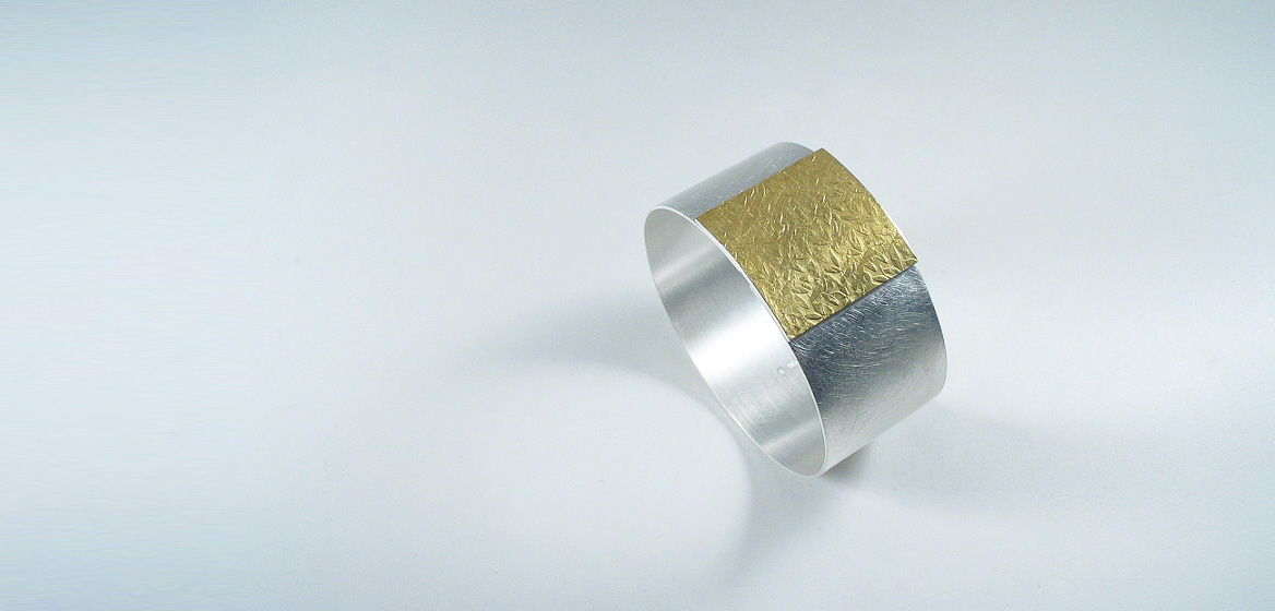 zilveren-armband-gecombineerd-met-beslagen-goud-18-krt.jpg
